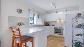 Microwave, dishwasher, dining tables