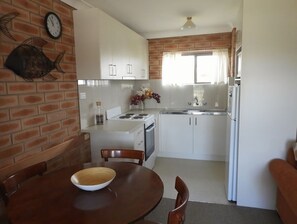 Microwave, dishwasher, dining tables