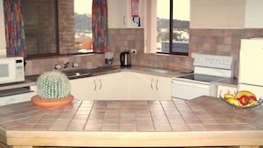 Microwave, dishwasher, dining tables