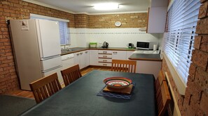 Microwave, dishwasher, dining tables