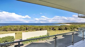 A balcony with a view of the ocean and greenery. - Quarterdeck 3 (Tura Beach)
