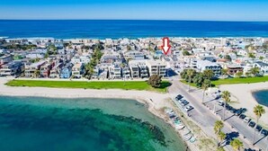 An aerial view of a coastal town with buildings, a beach, and a parking area. - 4 Outdoor Areas * A/C * 5 Parking * 3 Levels * Dog OK (San Diego)