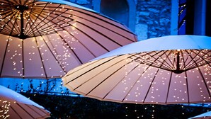 A serene indoor water feature with multiple fountains, surrounded by umbrellas and string lights, creating a tranquil atmosphere. - Prestige 5 star villa  (Saint-Rémy-de-Provence)