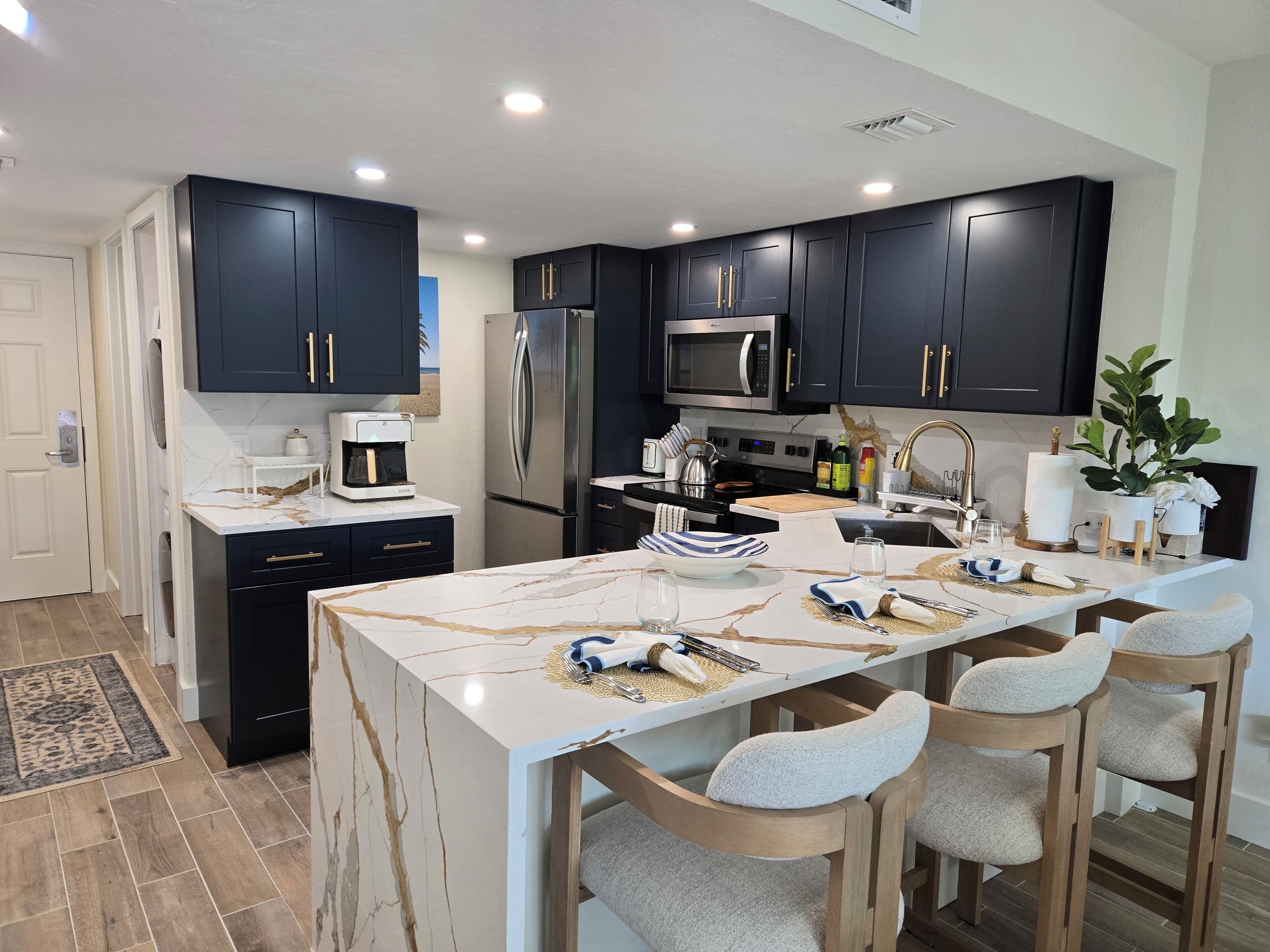 the kitchen with the waterfall counter extra wide