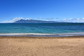 On the beach, sun loungers, beach towels