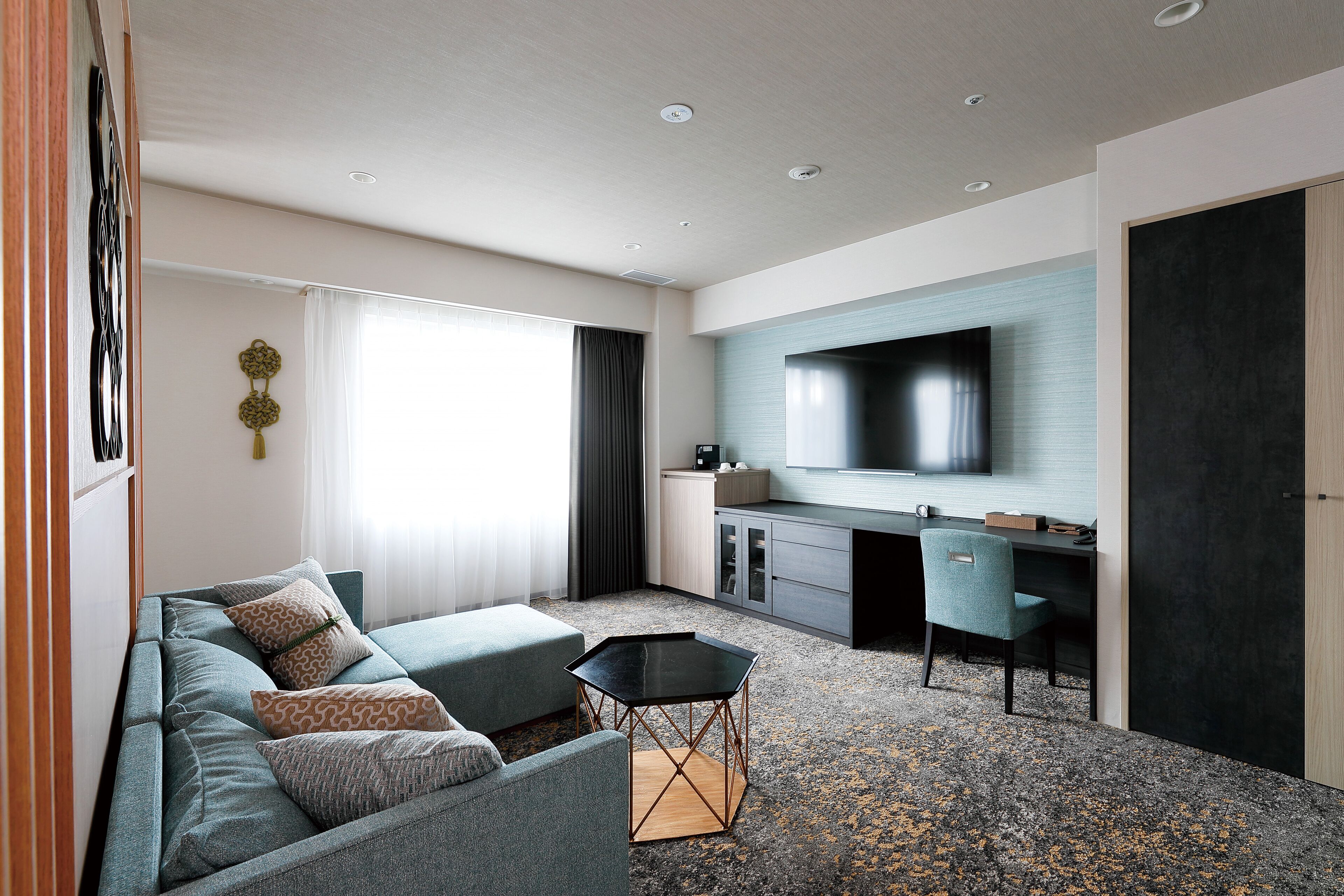 premium suite twin room | living room | 50-inch flat-screen tv with satellite channels, tv, pay films