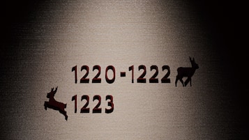 Silhouettes of a deer and a rabbit with numbers 1220-1222 and 1223 on a textured background.