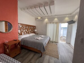 Comfort Suite | 1 bedroom, down comforters, individually furnished, blackout drapes - Suites (Puerto Ayora)
