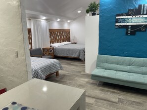 Comfort Quadruple Room, 1 Bedroom | 1 bedroom, down comforters, individually furnished, blackout drapes - Suites (Puerto Ayora)