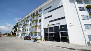 A modern building with a sign reading "Guaduales del Cafe". - Guaduales del café 304 (Montenegro)