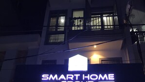 A building entrance with a sign reading "SMART HOME GROUP". - Smart Home Group (Ho Chi Minh City)