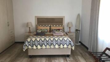 Deluxe Room, Garden View | Down comforters, blackout drapes, iron/ironing board, free WiFi