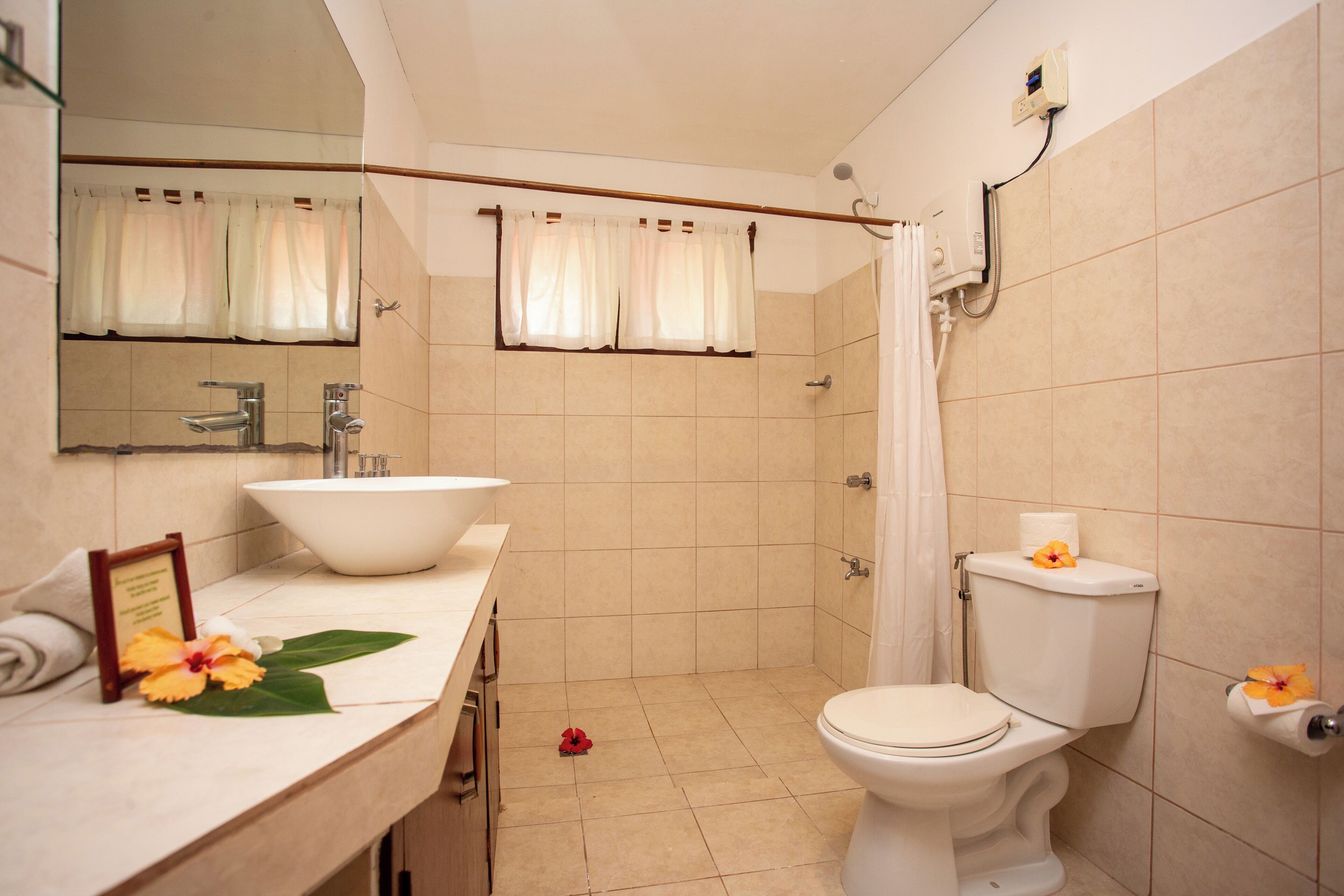 traditional bungalow | bathroom | free toiletries, hair dryer, slippers, soap