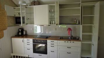Villa | Private kitchen | Fridge, microwave, oven, stovetop