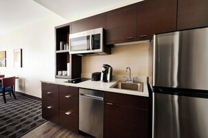 Studio, 2 Queen Beds | Private kitchen | Full-size fridge, microwave, stovetop, dishwasher
