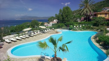 Seasonal outdoor pool, open 10:00 AM to 7:00 PM, pool umbrellas