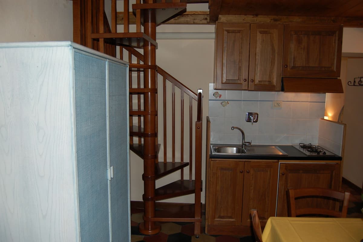 Apartment, 1 Bedroom, Kitchenette, Tower | Private kitchen | Stovetop, highchair, cookware/dishes/utensils, dining tables