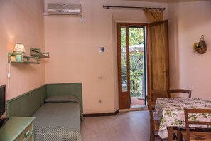 Apartment, 1 Bedroom, Kitchenette, Tower | Living area | 20-inch TV with satellite channels