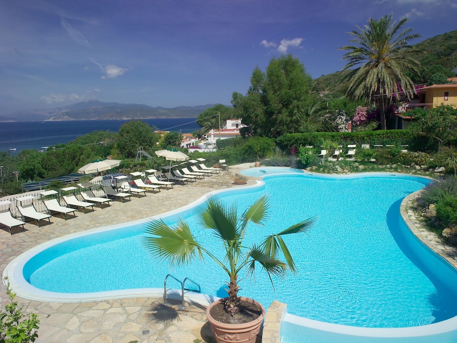 Seasonal outdoor pool, open 10:00 AM to 7:00 PM, pool umbrellas