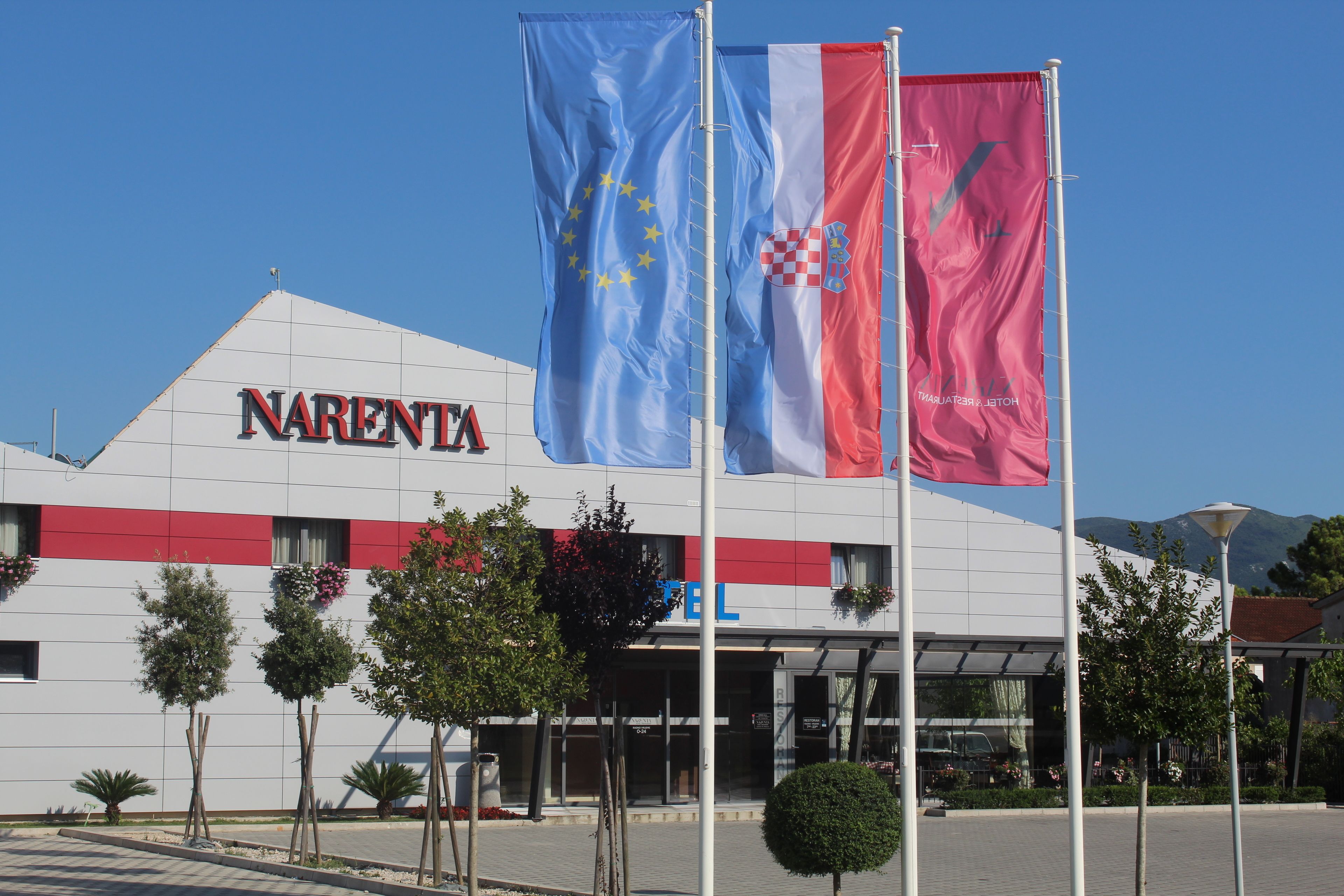 A hotel named "NARENTA" with flags of the EU and Croatia.