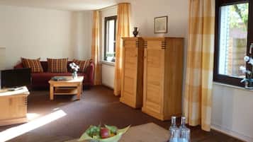 Apartment, 1 Bedroom, Balcony | Living area | Flat-screen TV