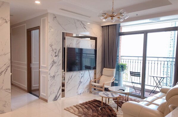 55-inch flat-screen TV with cable channels, TV - LANDMARK PLUS RESIDENCES LUXURY SUITE (Ho Chi Minh City)
