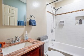 Combined shower/tub, hair dryer, towels, soap