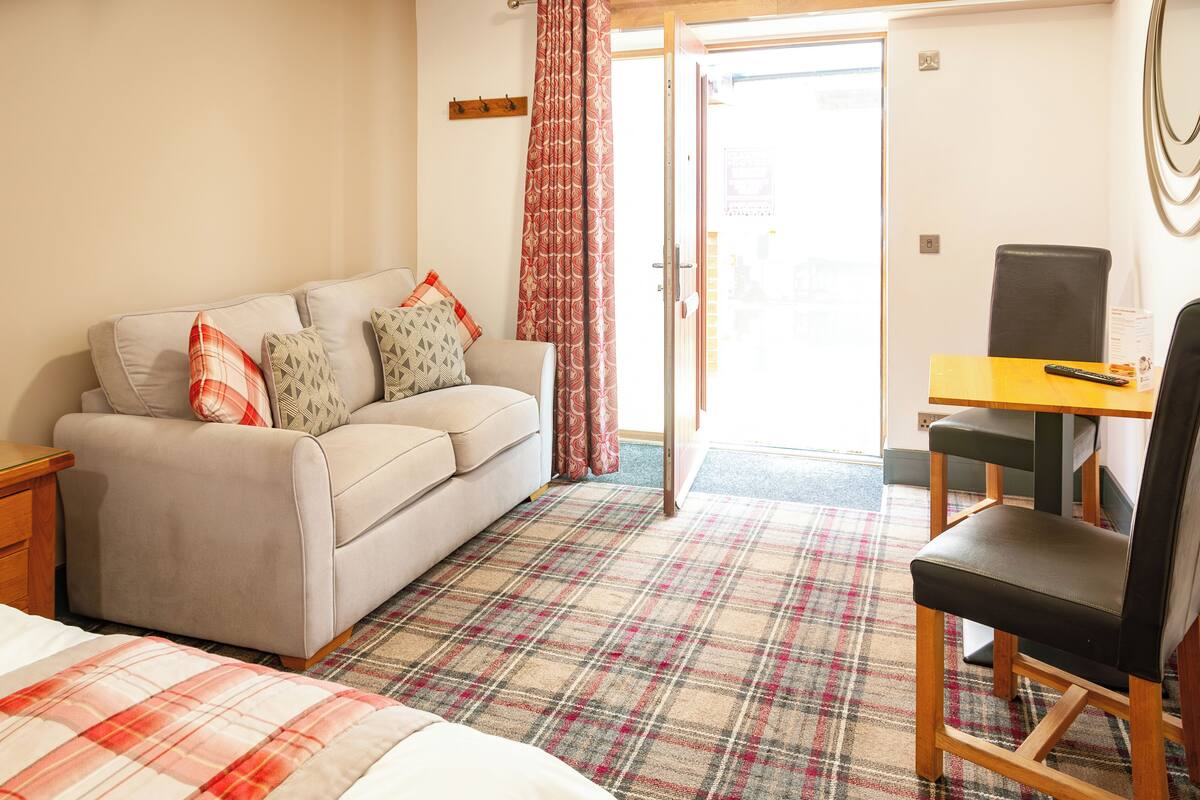 superior quadruple room, ground floor | 1 bedroom, desk, laptop workspace, blackout curtains