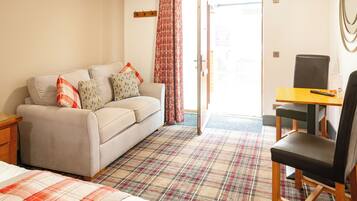 Desk, laptop workspace, blackout curtains, free WiFi