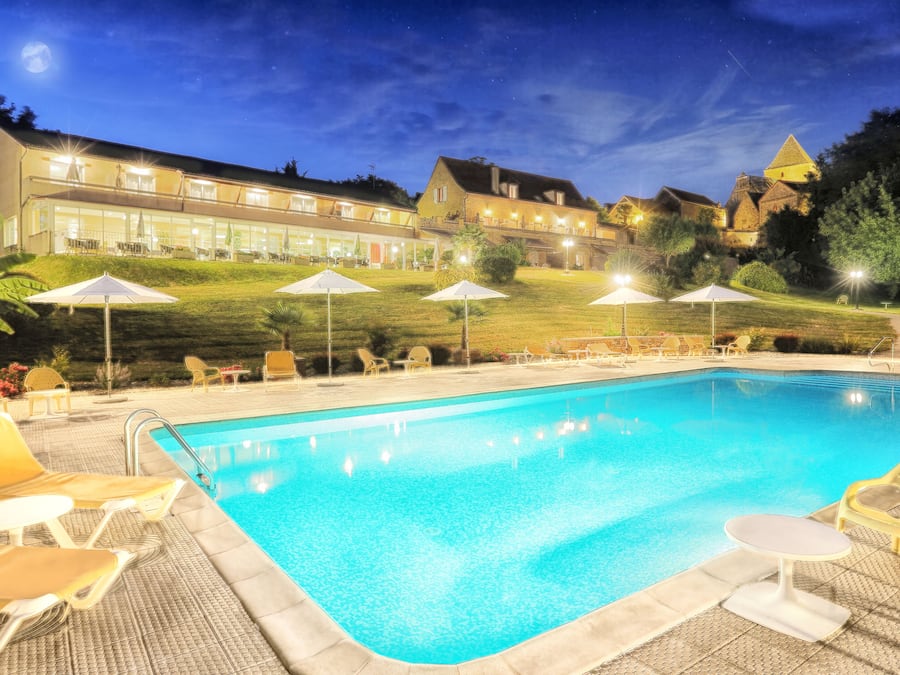 Seasonal outdoor pool, open 8:00 AM to 10:00 PM, pool umbrellas