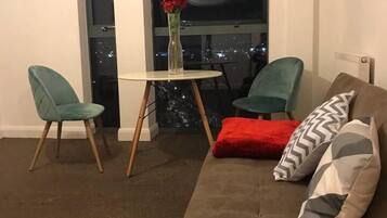 Luxury Apartment | Living area | Flat-screen TV