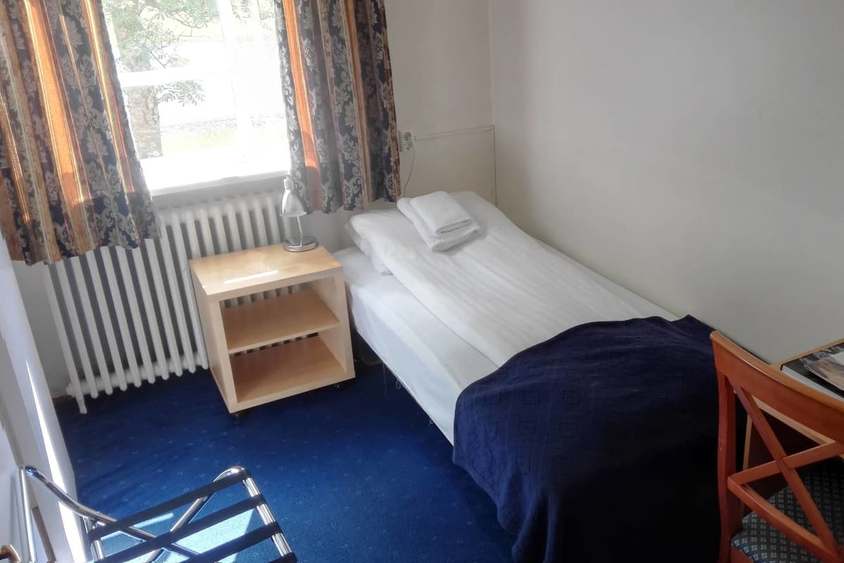 Standaard eenpersoonskamer, privébadkamer | Verduisterende gordijnen, gratis babybedden, gratis wifi, beddengoed
