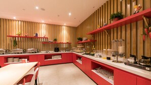 A modern kitchen with red cabinetry, a white countertop, and various kitchen appliances. - Ibis Xi'an Jianzhang Road Fengdong New Area Hotel (Xi'an)