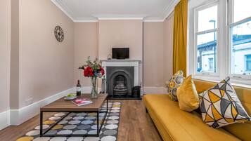 Luxury Apartment | Living area | Flat-screen TV