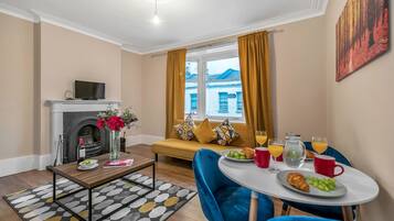 Luxury Apartment | Living area | Flat-screen TV