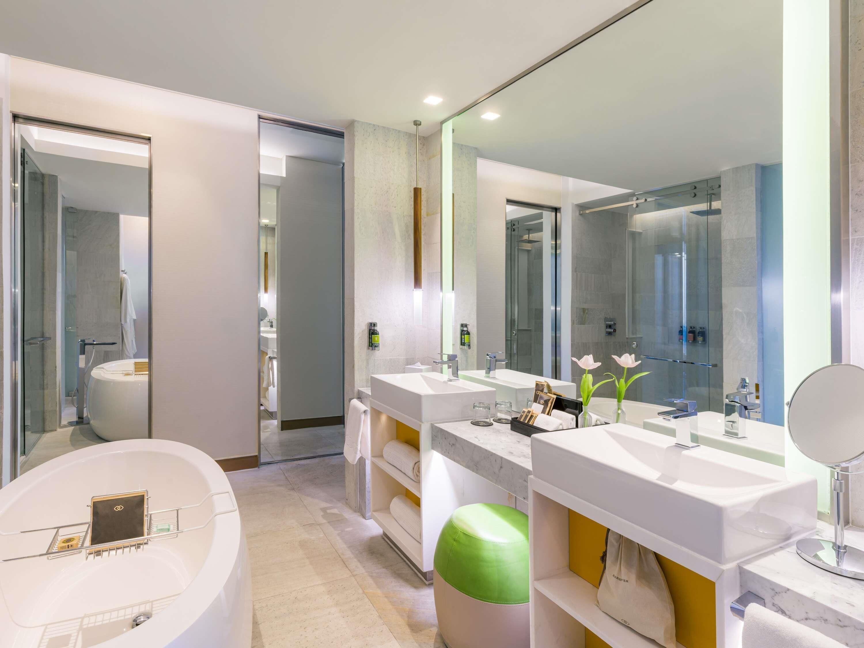 Designer toiletries, hair dryer, bathrobes, slippers