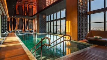 Indoor pool, open 7:30 AM to 10:00 PM, pool loungers