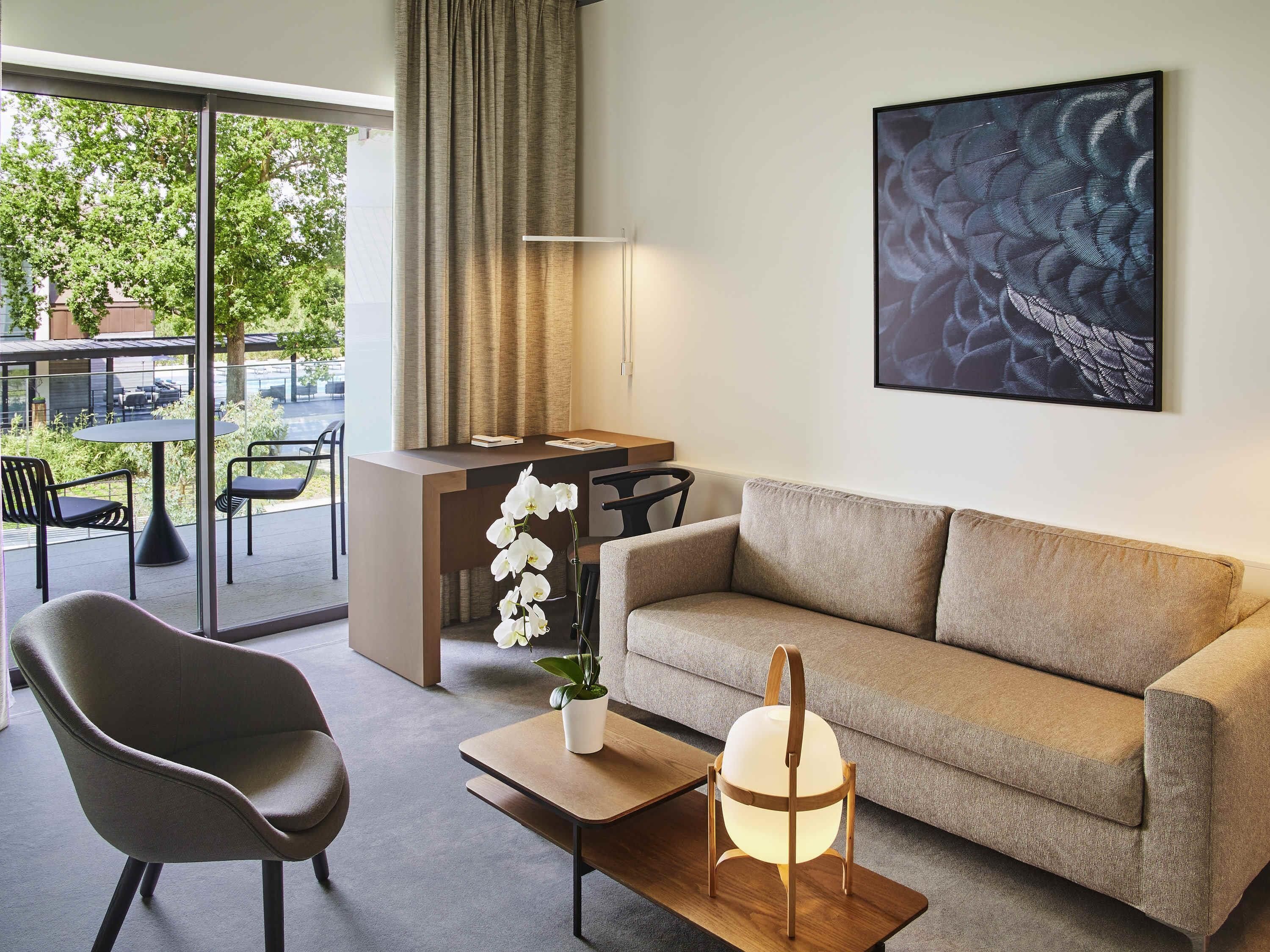 junior suite, 1 king bed with sofa bed (patio view) | premium bedding, minibar, in-room safe, individually decorated