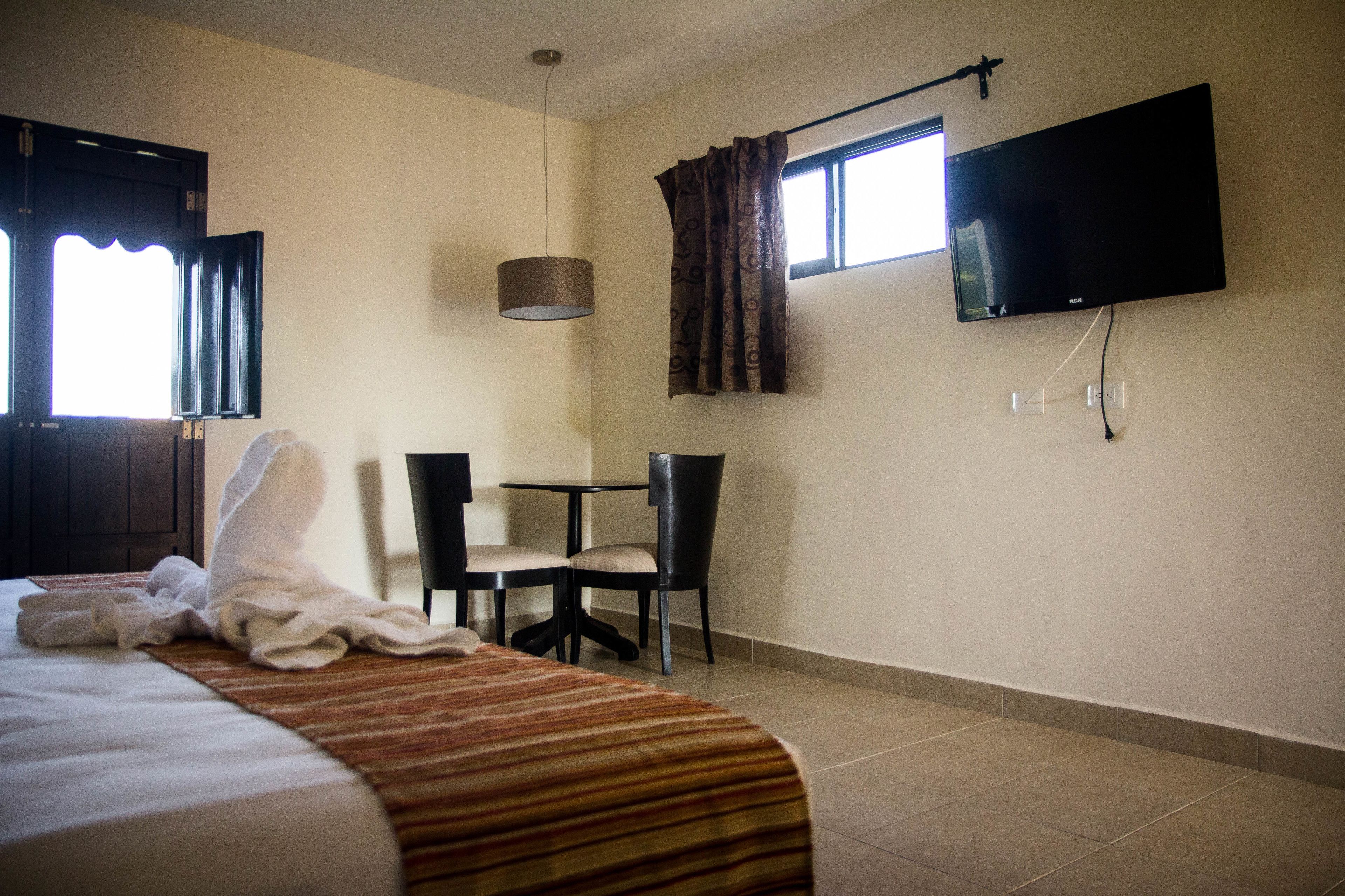 junior room, 1 king bed, non smoking, garden view | iron/ironing board, free wifi, bed sheets