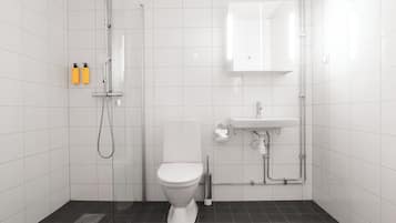 Un baño moderno con azulejos blancos, inodoro, ducha y lavamanos.