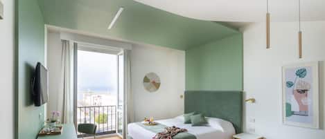 Junior Suite, Sea View | Down comforters, memory foam beds, minibar, in-room safe