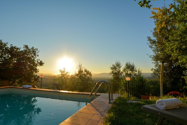Outdoor pool, open 7:30 AM to 7:00 PM, pool loungers