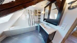 Bathtub, hair dryer, towels