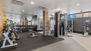A gym with various exercise equipment, including dumbbells, treadmills, and weight machines. - Kasa Union Station Denver (Denver)