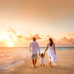 On the beach, white sand, sun loungers, beach umbrellas