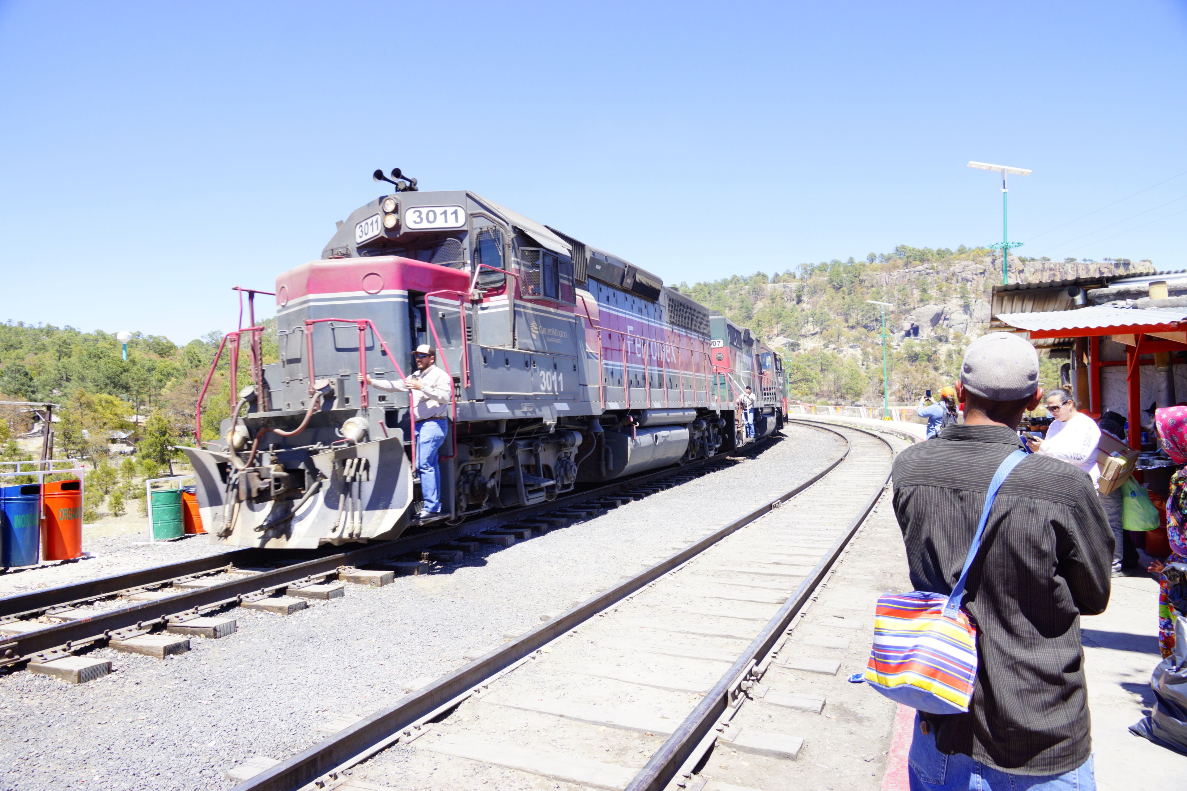 A train with the number 3011 on a railway track.
