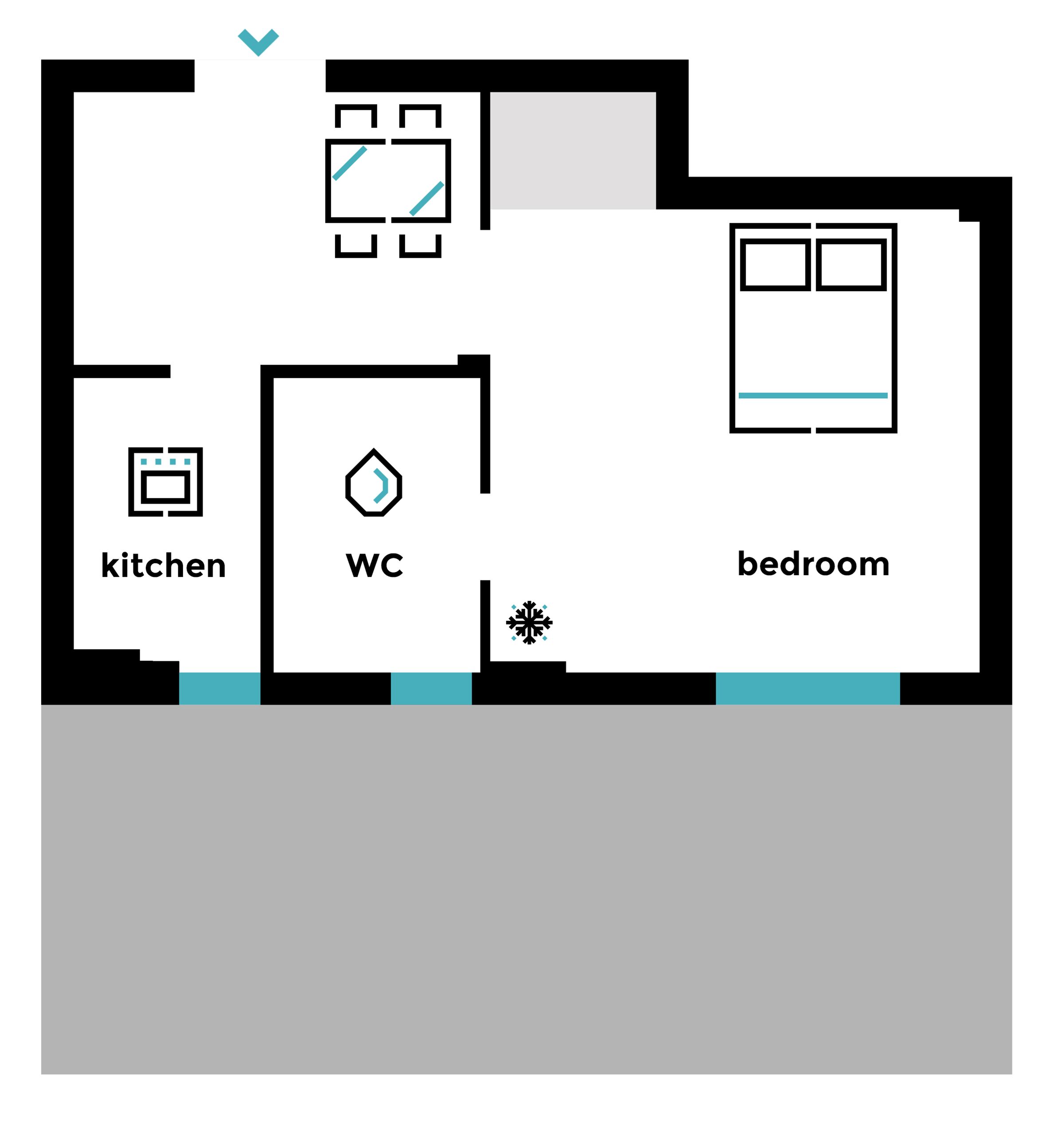 A floor plan with a kitchen, WC, and bedroom.