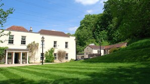 A two-story building with a traditional architectural style, featuring a symmetrical facade with evenly spaced windows and a central entrance. - Georgian House with Indoor Swimming Pool (Willsbridge)
