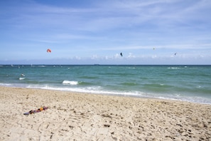Enjoy a serene beach experience with calm seas and opportunities to fly a kite.