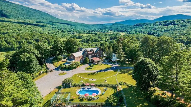 An aerial view of a large estate with a swimming pool, tennis court, and a spacious lawn. - The Privacy of a home & Perks of a Resort! Pool, Tennis, Views, Dogs, 6 baths! (Manchester)